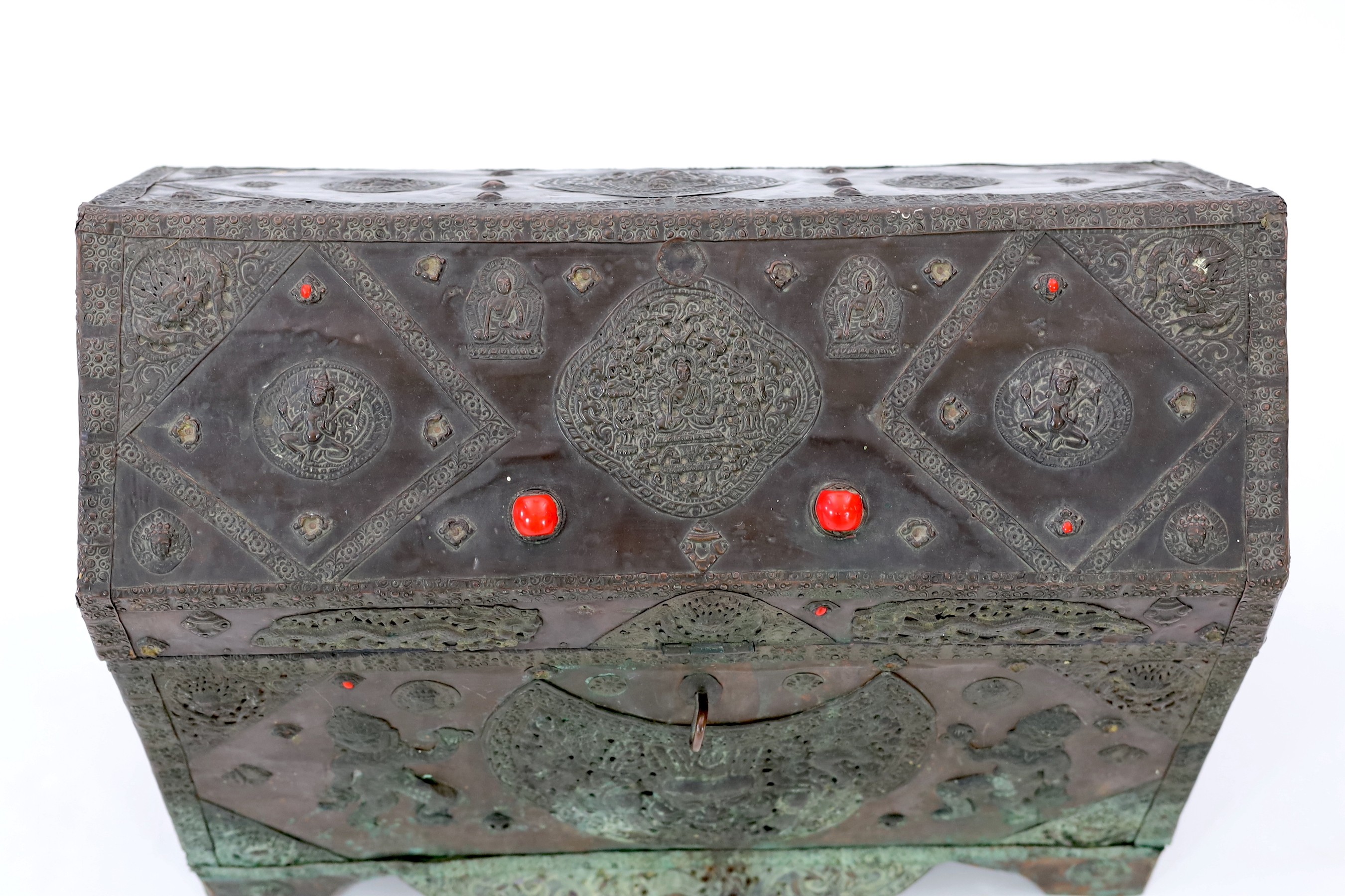 A Tibetan copper repousse-work casket, 20th century, 65cm wide, 49.5cm